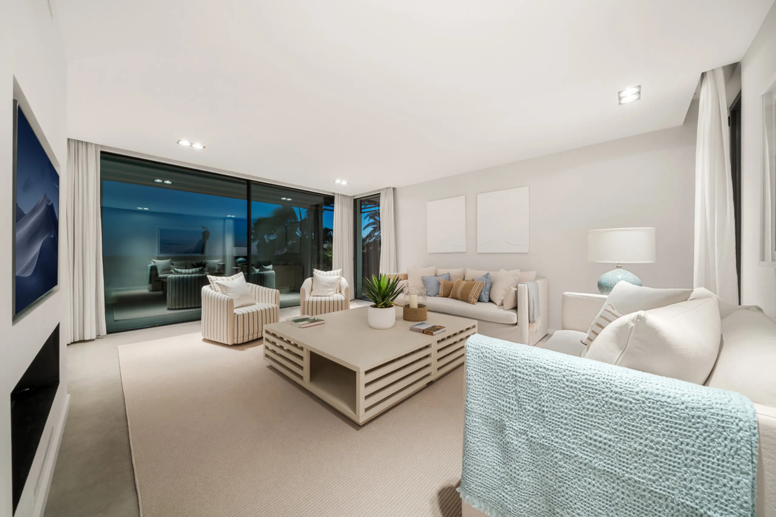 Boasting of panoramic sea views, a contemporary showpiece villa sitting in a privileged beachfront position in the New Golden Mile, surrounded by an expansive private garden with a large private swimming pool. The ideal family estate offering a dynamic ou