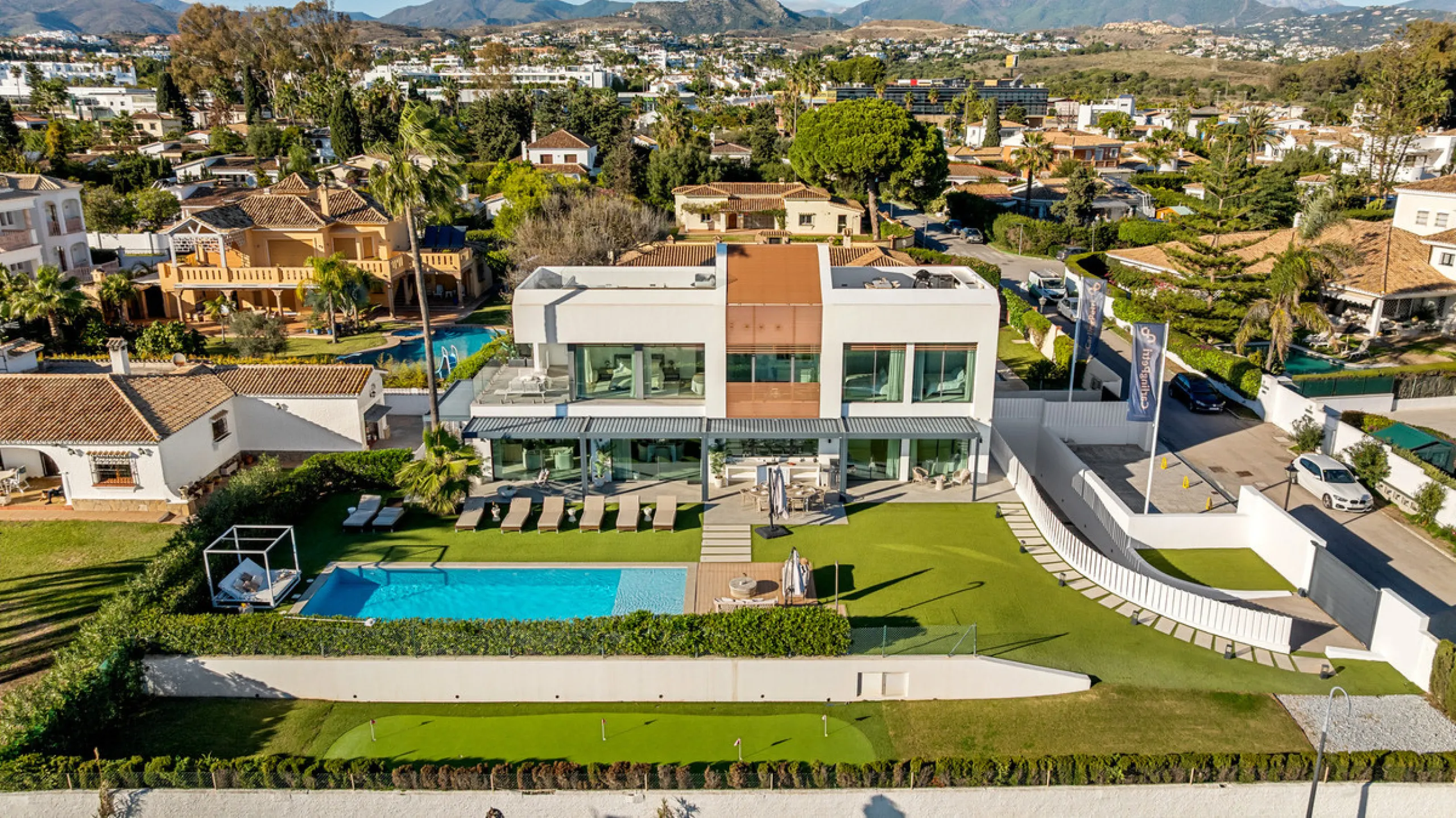 Boasting of panoramic sea views, a contemporary showpiece villa sitting in a privileged beachfront position in the New Golden Mile, surrounded by an expansive private garden with a large private swimming pool. The ideal family estate offering a dynamic ou