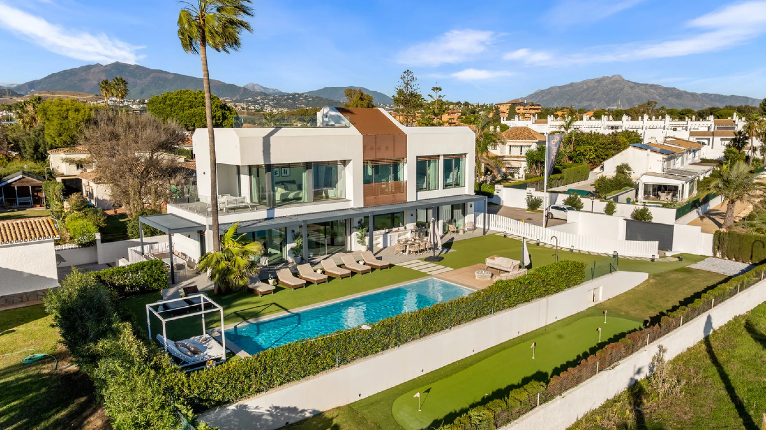 Boasting of panoramic sea views, a contemporary showpiece villa sitting in a privileged beachfront position in the New Golden Mile, surrounded by an expansive private garden with a large private swimming pool. The ideal family estate offering a dynamic ou