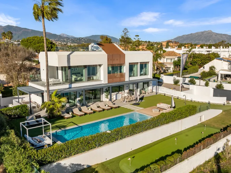 Boasting of panoramic sea views, a contemporary showpiece villa sitting in a privileged beachfront position in the New Golden Mile, surrounded by an expansive private garden with a large private swimming pool. The ideal family estate offering a dynamic ou