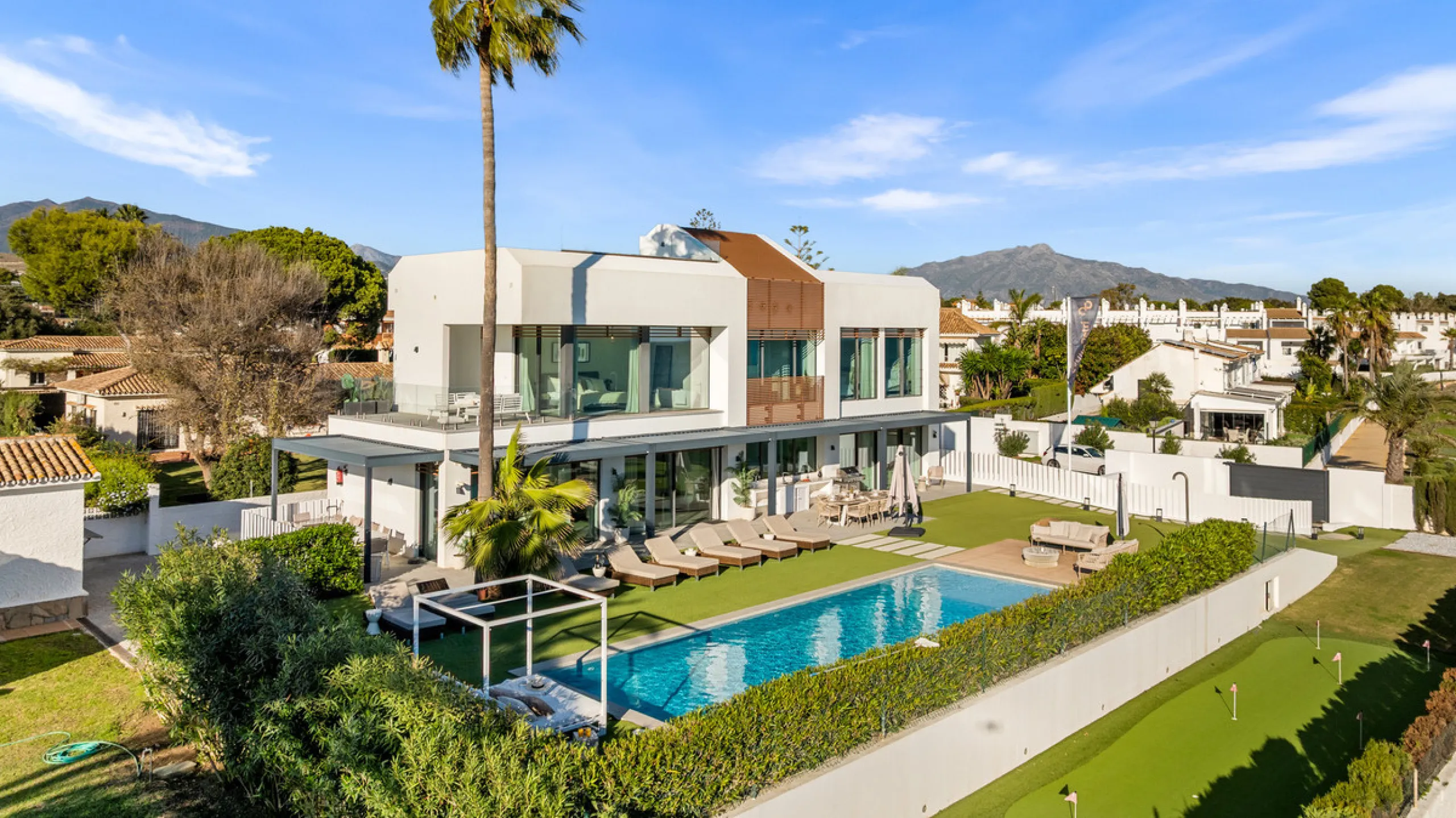 Boasting of panoramic sea views, a contemporary showpiece villa sitting in a privileged beachfront position in the New Golden Mile, surrounded by an expansive private garden with a large private swimming pool. The ideal family estate offering a dynamic ou