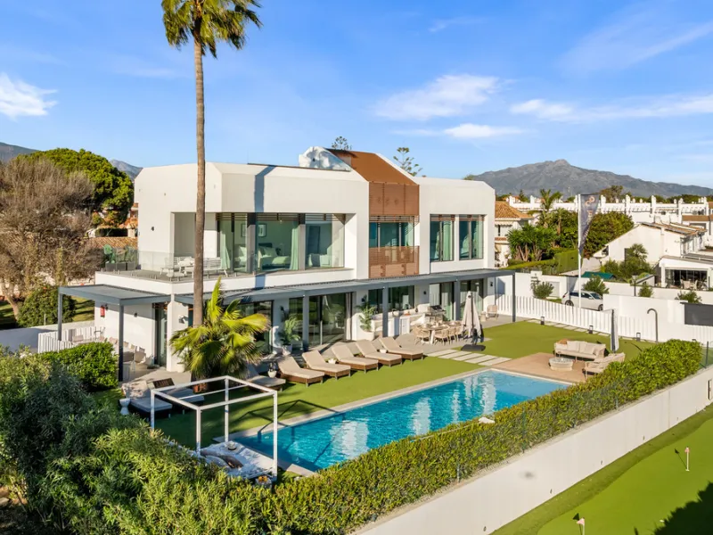Boasting of panoramic sea views, a contemporary showpiece villa sitting in a privileged beachfront position in the New Golden Mile, surrounded by an expansive private garden with a large private swimming pool. The ideal family estate offering a dynamic ou