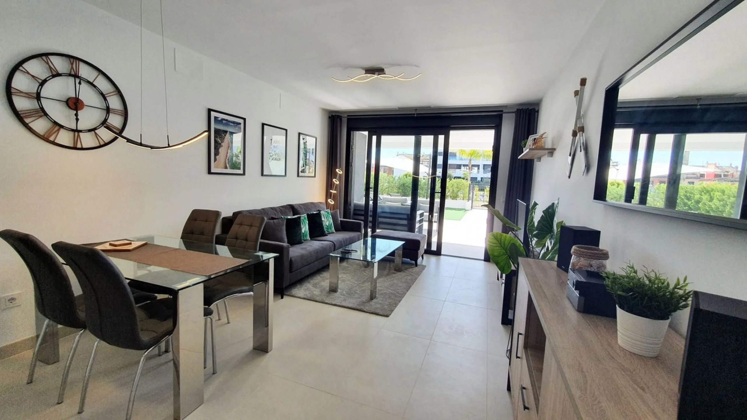 This stunning ground-floor apartment in Los Miradores del Sol Phase I perfectly combines contemporary luxury with Mediterranean indoor-outdoor living on Estepona's exclusive New Golden Mile. Offering 92 m² of elegant interior space and an impressive 84 m²