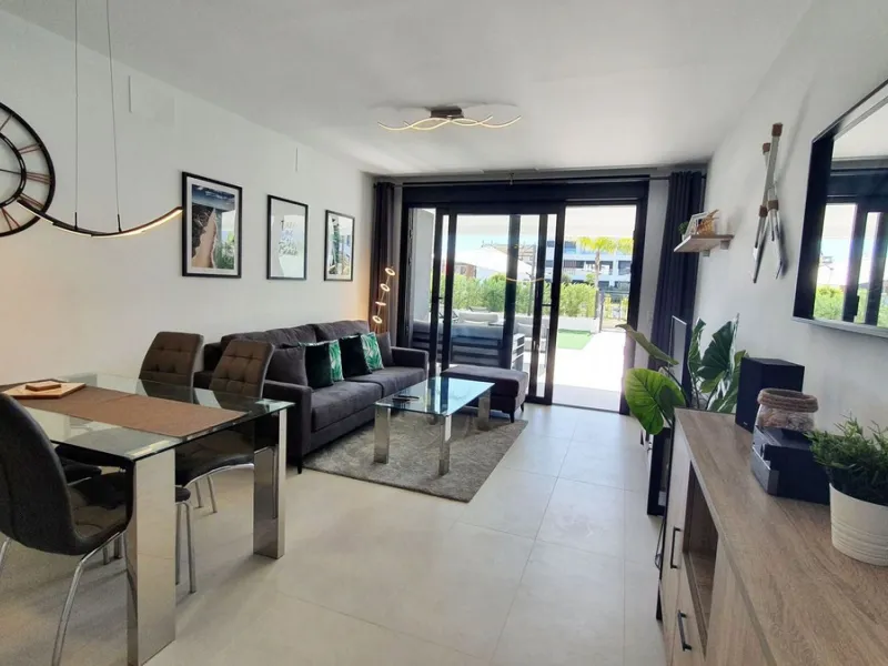 This stunning ground-floor apartment in Los Miradores del Sol Phase I perfectly combines contemporary luxury with Mediterranean indoor-outdoor living on Estepona's exclusive New Golden Mile. Offering 92 m² of elegant interior space and an impressive 84 m²