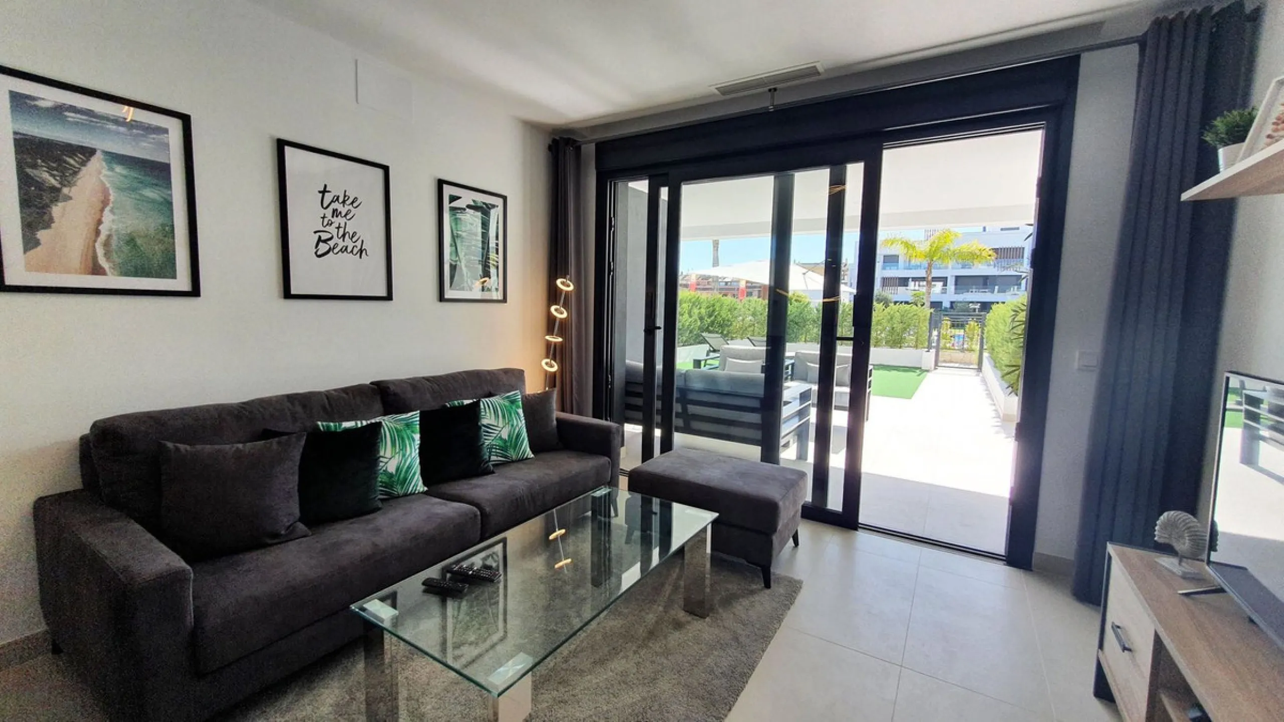 This stunning ground-floor apartment in Los Miradores del Sol Phase I perfectly combines contemporary luxury with Mediterranean indoor-outdoor living on Estepona's exclusive New Golden Mile. Offering 92 m² of elegant interior space and an impressive 84 m²
