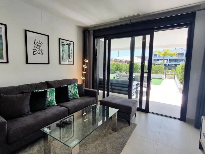 This stunning ground-floor apartment in Los Miradores del Sol Phase I perfectly combines contemporary luxury with Mediterranean indoor-outdoor living on Estepona's exclusive New Golden Mile. Offering 92 m² of elegant interior space and an impressive 84 m²