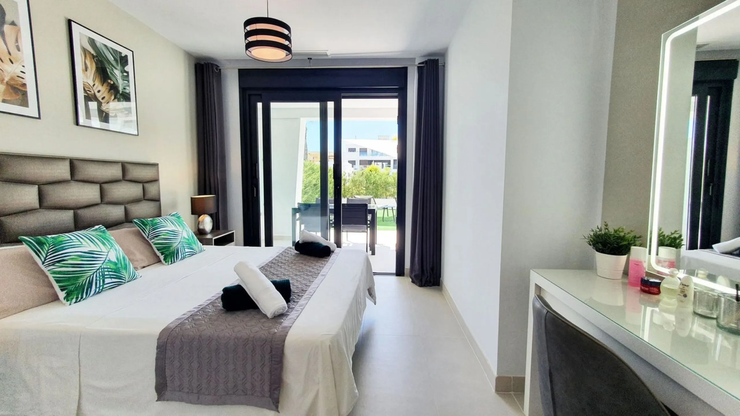 This stunning ground-floor apartment in Los Miradores del Sol Phase I perfectly combines contemporary luxury with Mediterranean indoor-outdoor living on Estepona's exclusive New Golden Mile. Offering 92 m² of elegant interior space and an impressive 84 m²