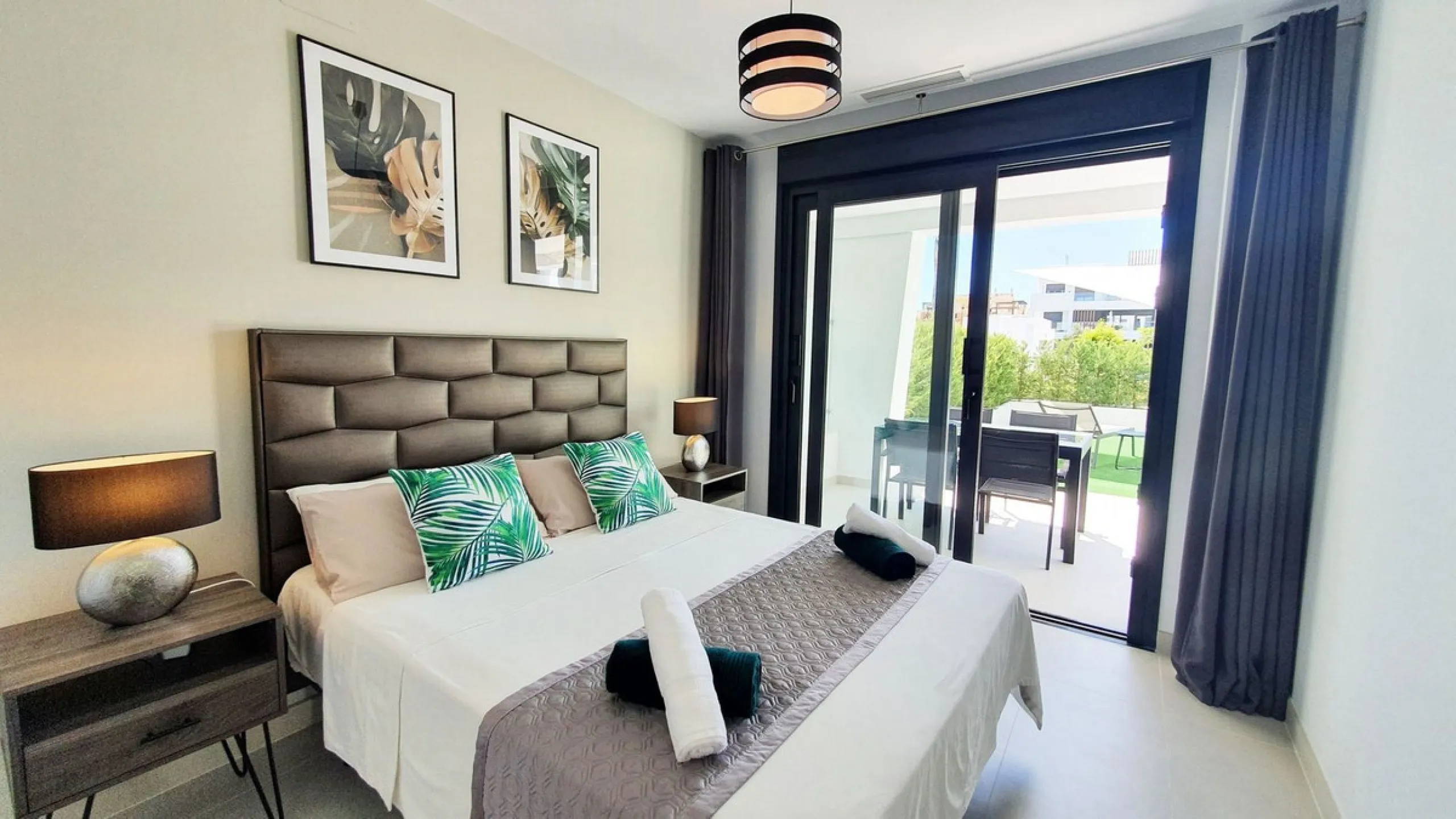 This stunning ground-floor apartment in Los Miradores del Sol Phase I perfectly combines contemporary luxury with Mediterranean indoor-outdoor living on Estepona's exclusive New Golden Mile. Offering 92 m² of elegant interior space and an impressive 84 m²