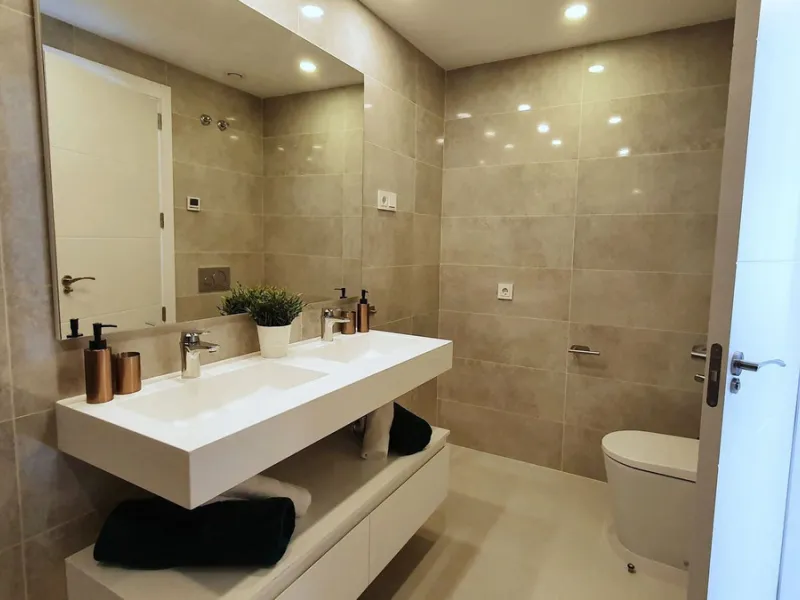 This stunning ground-floor apartment in Los Miradores del Sol Phase I perfectly combines contemporary luxury with Mediterranean indoor-outdoor living on Estepona's exclusive New Golden Mile. Offering 92 m² of elegant interior space and an impressive 84 m²