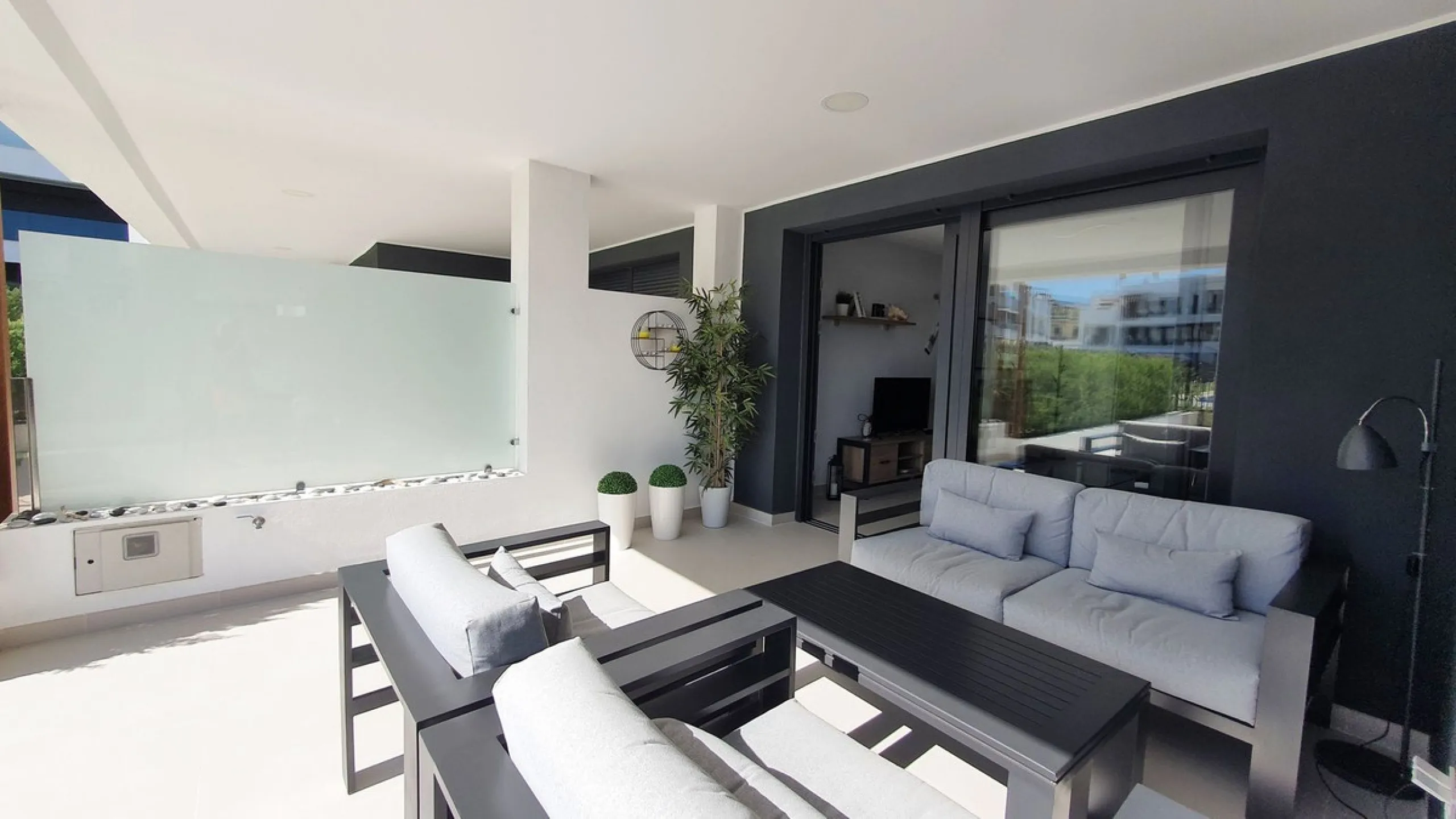 This stunning ground-floor apartment in Los Miradores del Sol Phase I perfectly combines contemporary luxury with Mediterranean indoor-outdoor living on Estepona's exclusive New Golden Mile. Offering 92 m² of elegant interior space and an impressive 84 m²