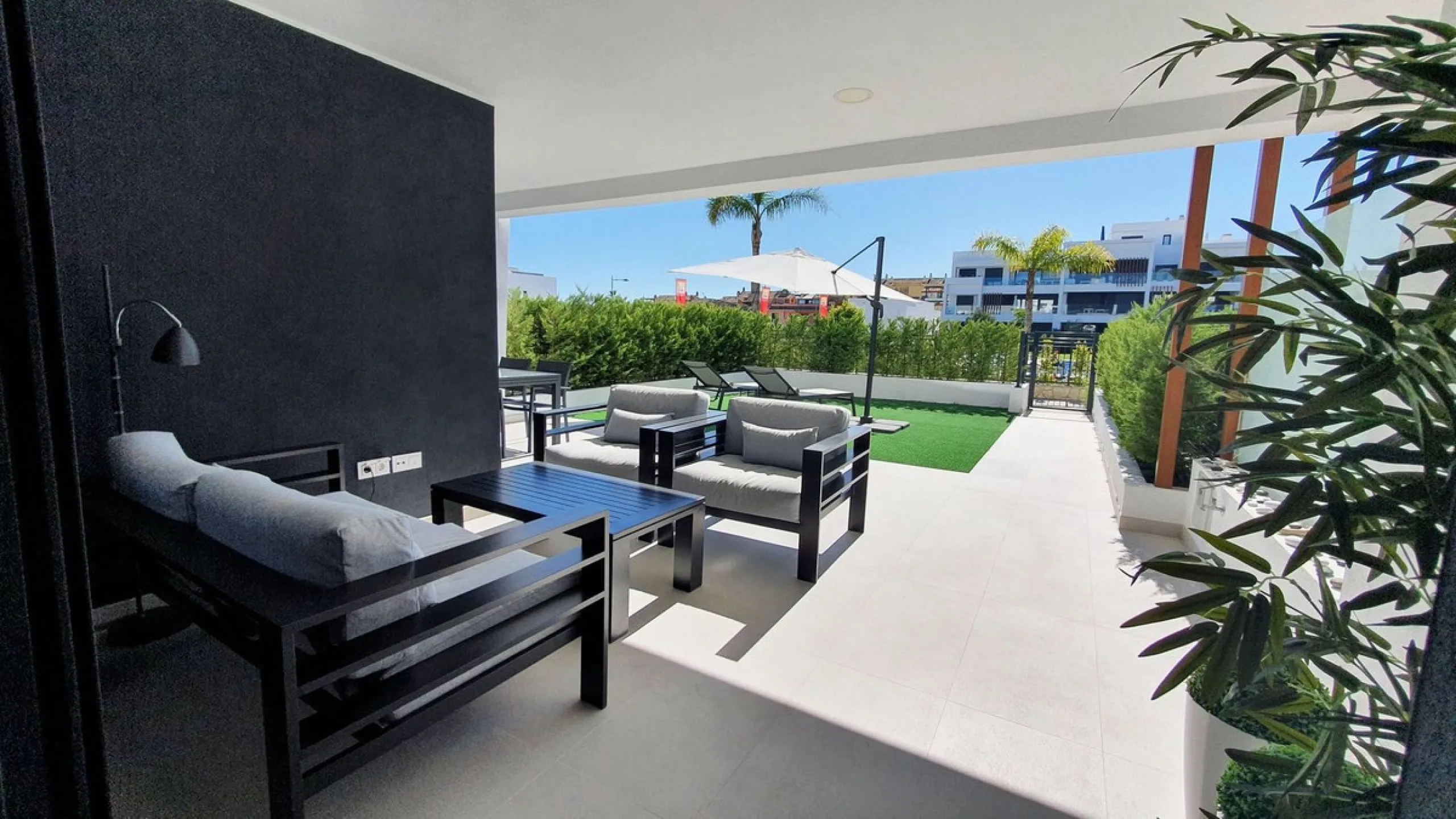 This stunning ground-floor apartment in Los Miradores del Sol Phase I perfectly combines contemporary luxury with Mediterranean indoor-outdoor living on Estepona's exclusive New Golden Mile. Offering 92 m² of elegant interior space and an impressive 84 m²