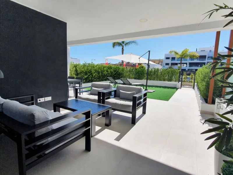 This stunning ground-floor apartment in Los Miradores del Sol Phase I perfectly combines contemporary luxury with Mediterranean indoor-outdoor living on Estepona's exclusive New Golden Mile. Offering 92 m² of elegant interior space and an impressive 84 m²
