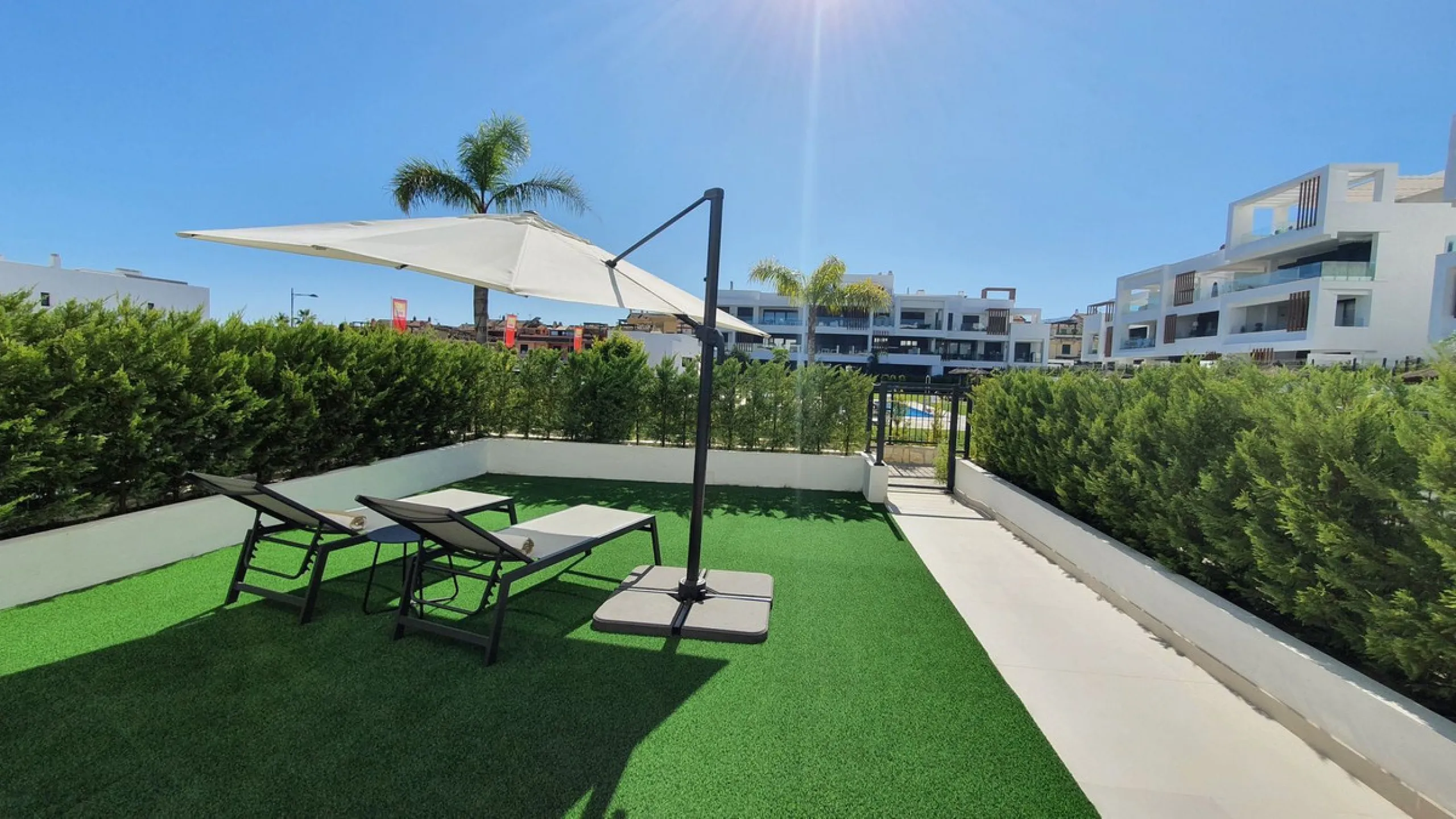 This stunning ground-floor apartment in Los Miradores del Sol Phase I perfectly combines contemporary luxury with Mediterranean indoor-outdoor living on Estepona's exclusive New Golden Mile. Offering 92 m² of elegant interior space and an impressive 84 m²