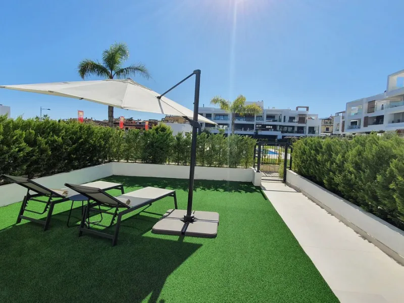 This stunning ground-floor apartment in Los Miradores del Sol Phase I perfectly combines contemporary luxury with Mediterranean indoor-outdoor living on Estepona's exclusive New Golden Mile. Offering 92 m² of elegant interior space and an impressive 84 m²
