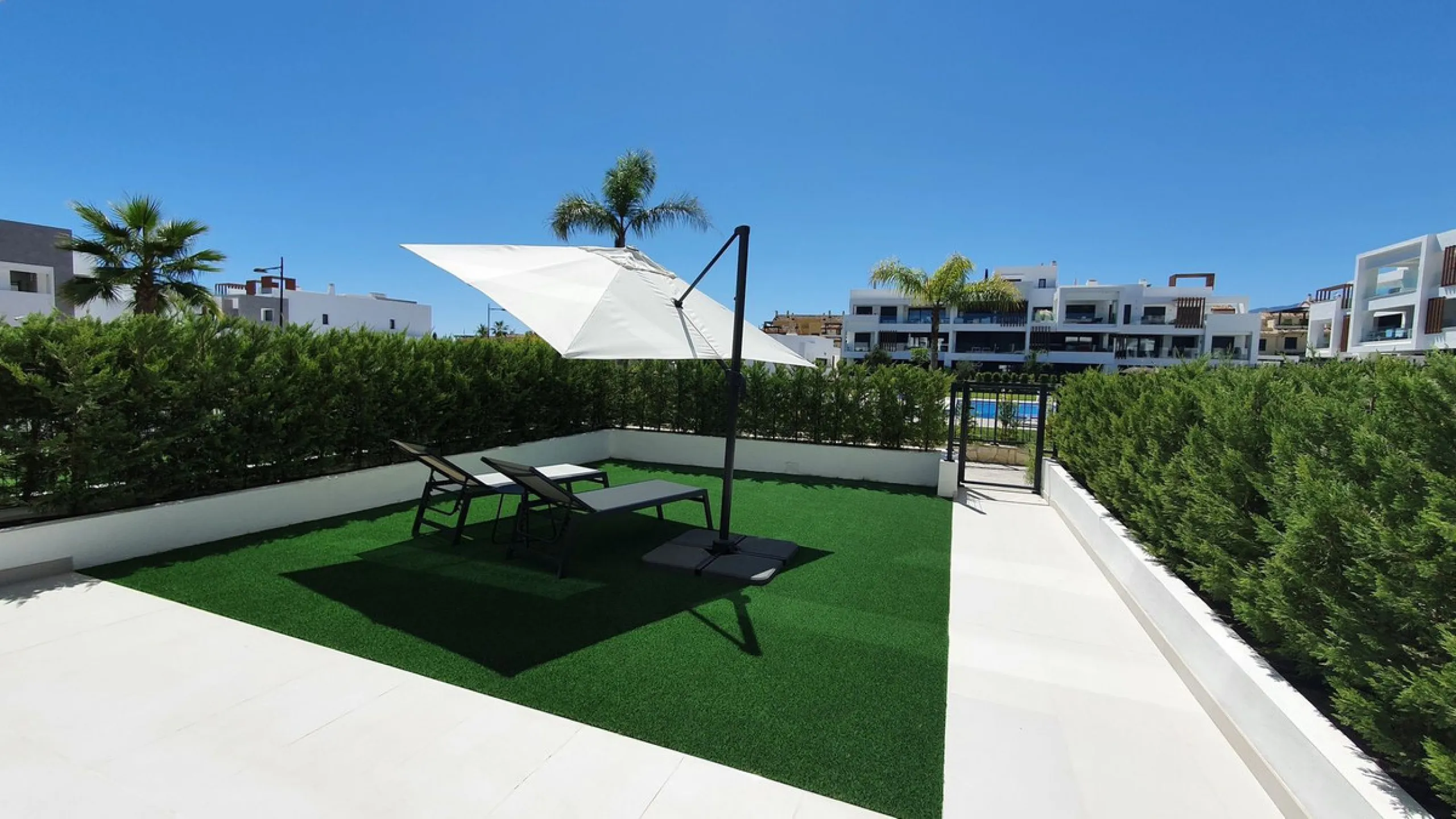 This stunning ground-floor apartment in Los Miradores del Sol Phase I perfectly combines contemporary luxury with Mediterranean indoor-outdoor living on Estepona's exclusive New Golden Mile. Offering 92 m² of elegant interior space and an impressive 84 m²