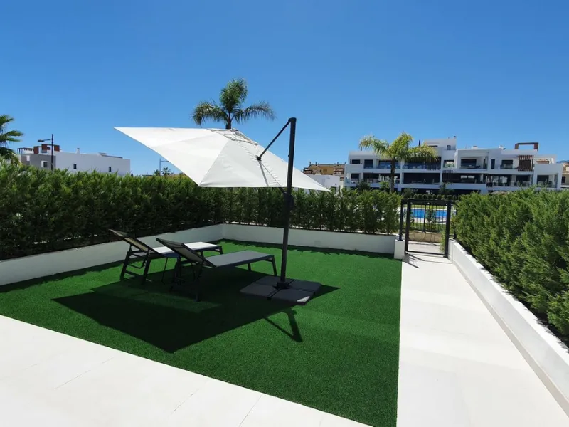 This stunning ground-floor apartment in Los Miradores del Sol Phase I perfectly combines contemporary luxury with Mediterranean indoor-outdoor living on Estepona's exclusive New Golden Mile. Offering 92 m² of elegant interior space and an impressive 84 m²