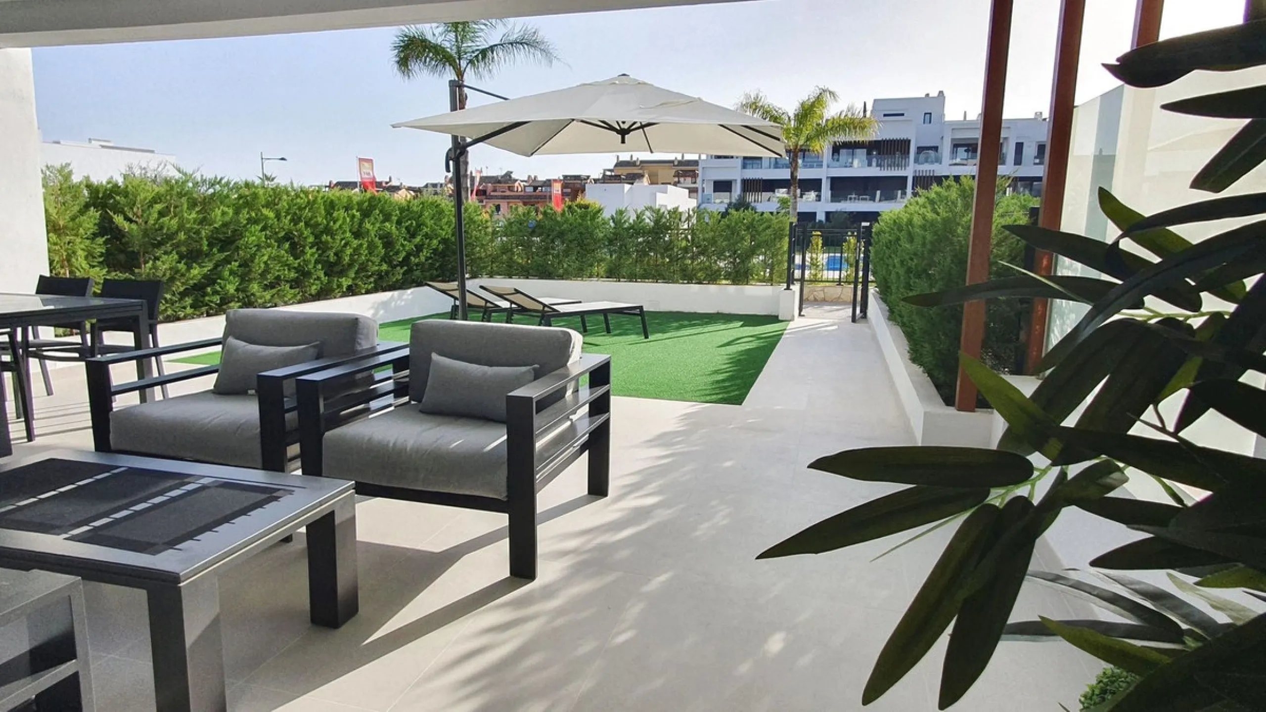 This stunning ground-floor apartment in Los Miradores del Sol Phase I perfectly combines contemporary luxury with Mediterranean indoor-outdoor living on Estepona's exclusive New Golden Mile. Offering 92 m² of elegant interior space and an impressive 84 m²