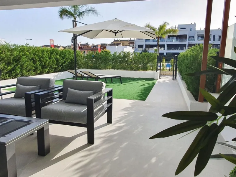 This stunning ground-floor apartment in Los Miradores del Sol Phase I perfectly combines contemporary luxury with Mediterranean indoor-outdoor living on Estepona's exclusive New Golden Mile. Offering 92 m² of elegant interior space and an impressive 84 m²