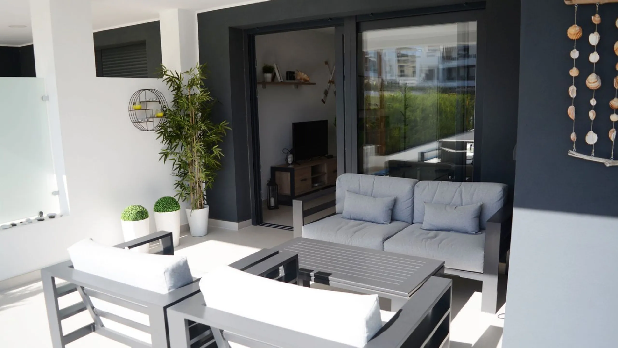 This stunning ground-floor apartment in Los Miradores del Sol Phase I perfectly combines contemporary luxury with Mediterranean indoor-outdoor living on Estepona's exclusive New Golden Mile. Offering 92 m² of elegant interior space and an impressive 84 m²