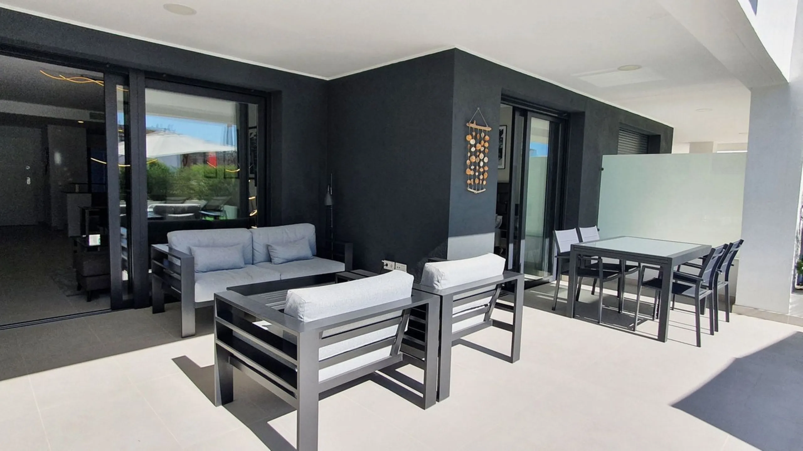 This stunning ground-floor apartment in Los Miradores del Sol Phase I perfectly combines contemporary luxury with Mediterranean indoor-outdoor living on Estepona's exclusive New Golden Mile. Offering 92 m² of elegant interior space and an impressive 84 m²