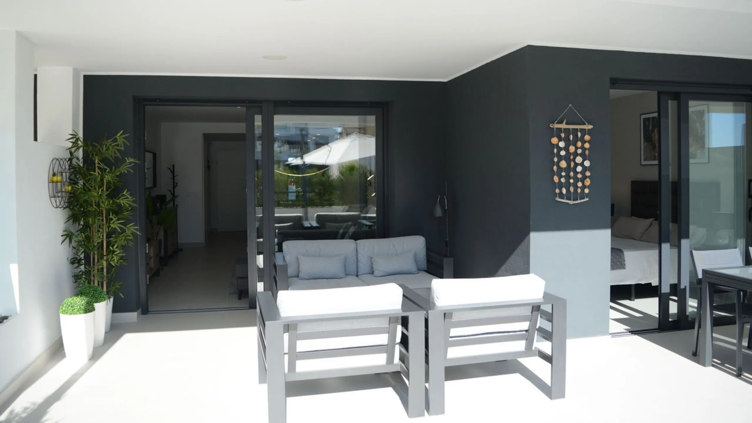 This stunning ground-floor apartment in Los Miradores del Sol Phase I perfectly combines contemporary luxury with Mediterranean indoor-outdoor living on Estepona's exclusive New Golden Mile. Offering 92 m² of elegant interior space and an impressive 84 m²