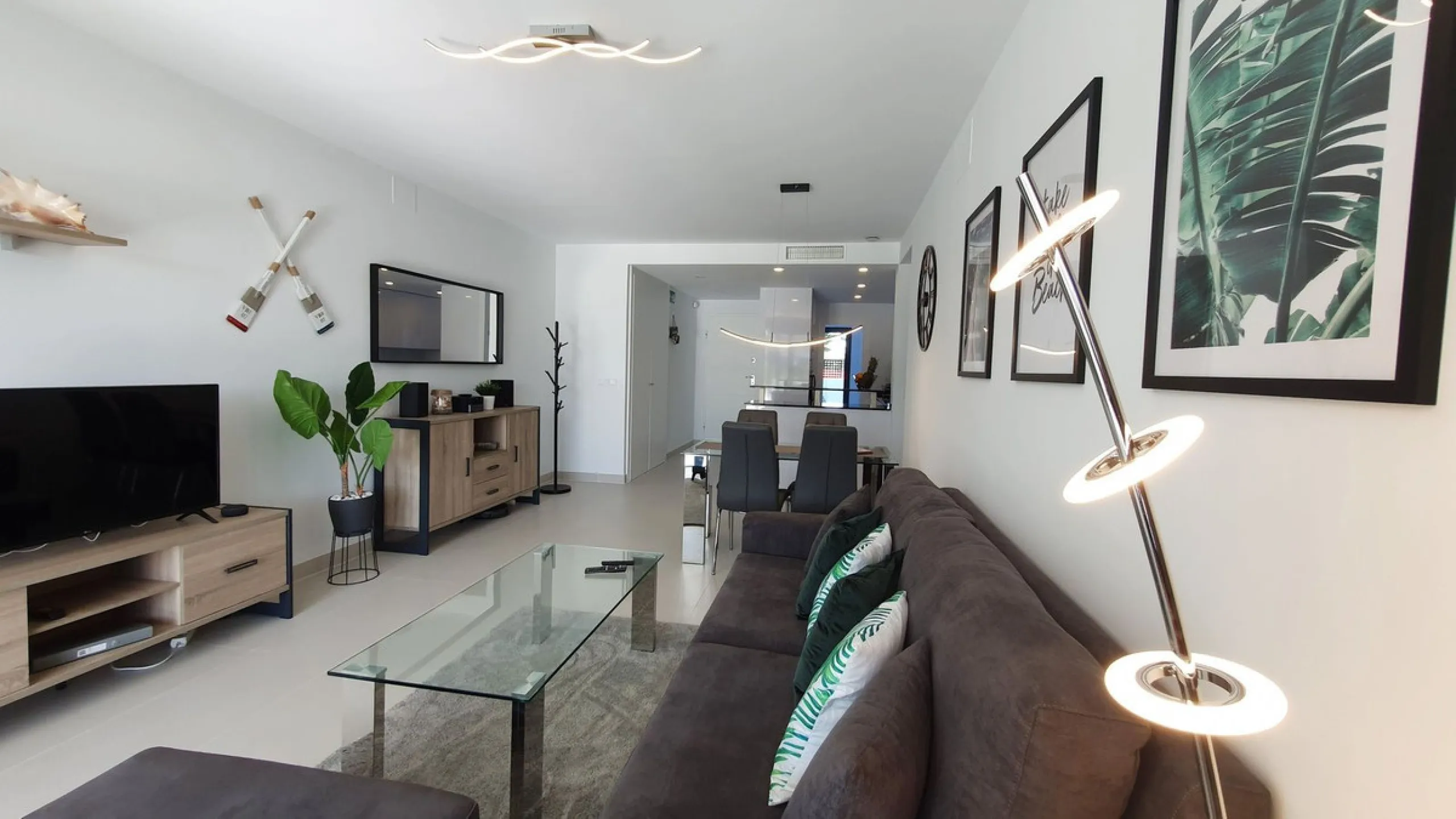 This stunning ground-floor apartment in Los Miradores del Sol Phase I perfectly combines contemporary luxury with Mediterranean indoor-outdoor living on Estepona's exclusive New Golden Mile. Offering 92 m² of elegant interior space and an impressive 84 m²