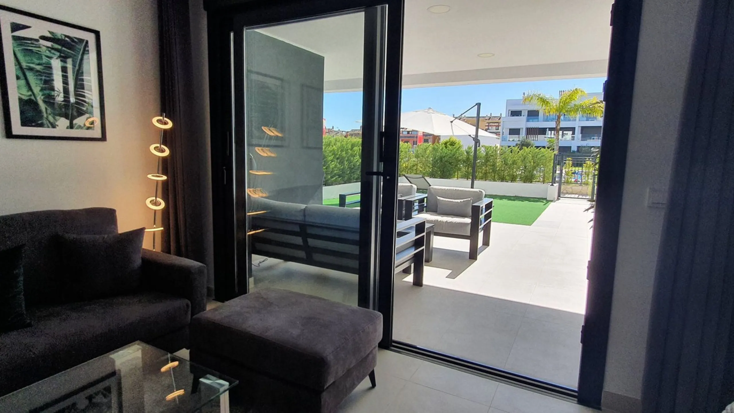 This stunning ground-floor apartment in Los Miradores del Sol Phase I perfectly combines contemporary luxury with Mediterranean indoor-outdoor living on Estepona's exclusive New Golden Mile. Offering 92 m² of elegant interior space and an impressive 84 m²