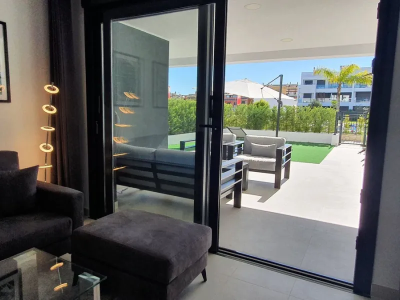 This stunning ground-floor apartment in Los Miradores del Sol Phase I perfectly combines contemporary luxury with Mediterranean indoor-outdoor living on Estepona's exclusive New Golden Mile. Offering 92 m² of elegant interior space and an impressive 84 m²