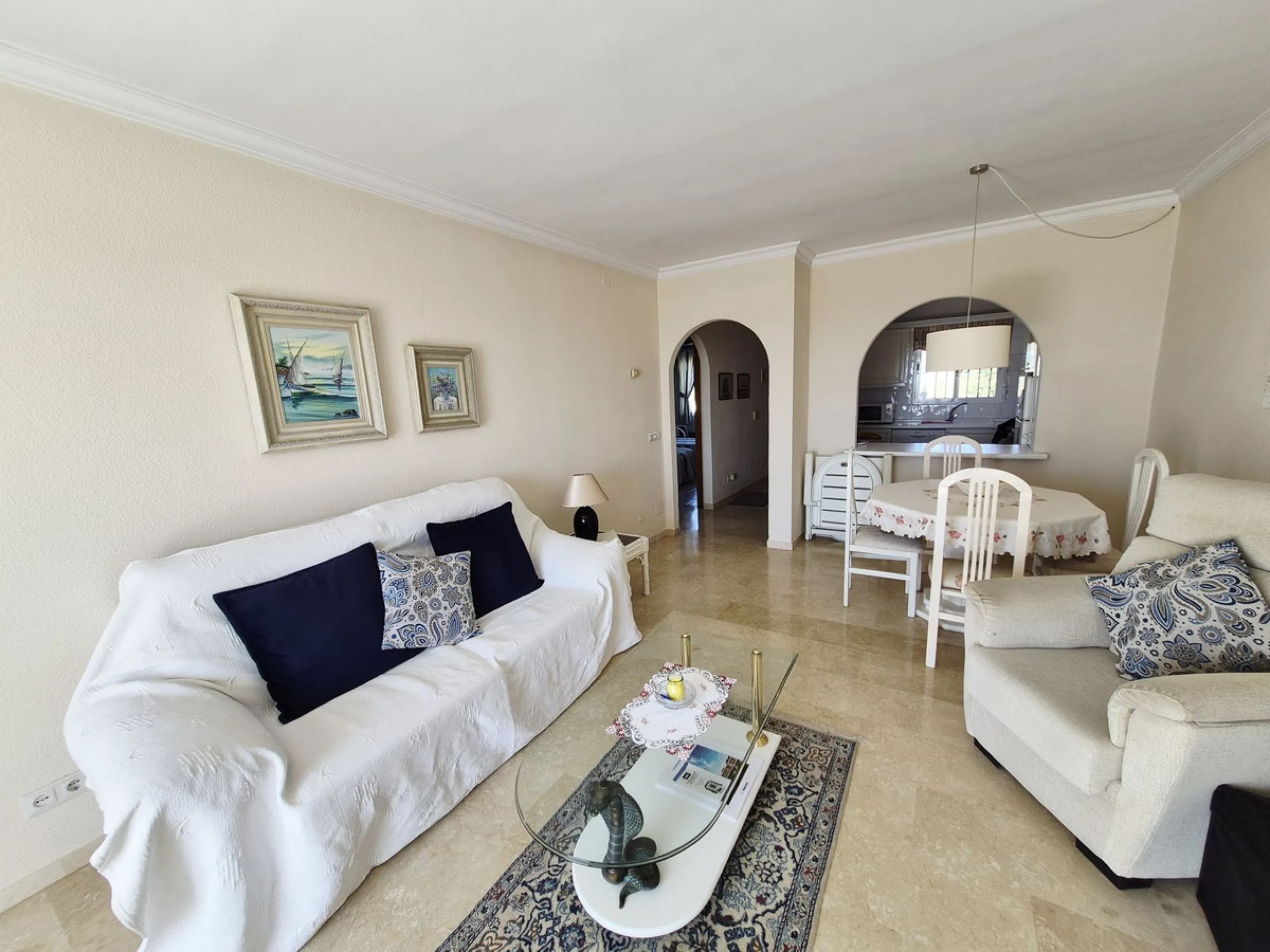 INCREDIBLE PANORAMIC VIEWS FROM THIS BRIGHT AND SPACIOUS APARTMENT WHICH LOOKS OUT OVER THE BAY OF LA CALA  AND EL CHAPARRAL GOLF COURSE.