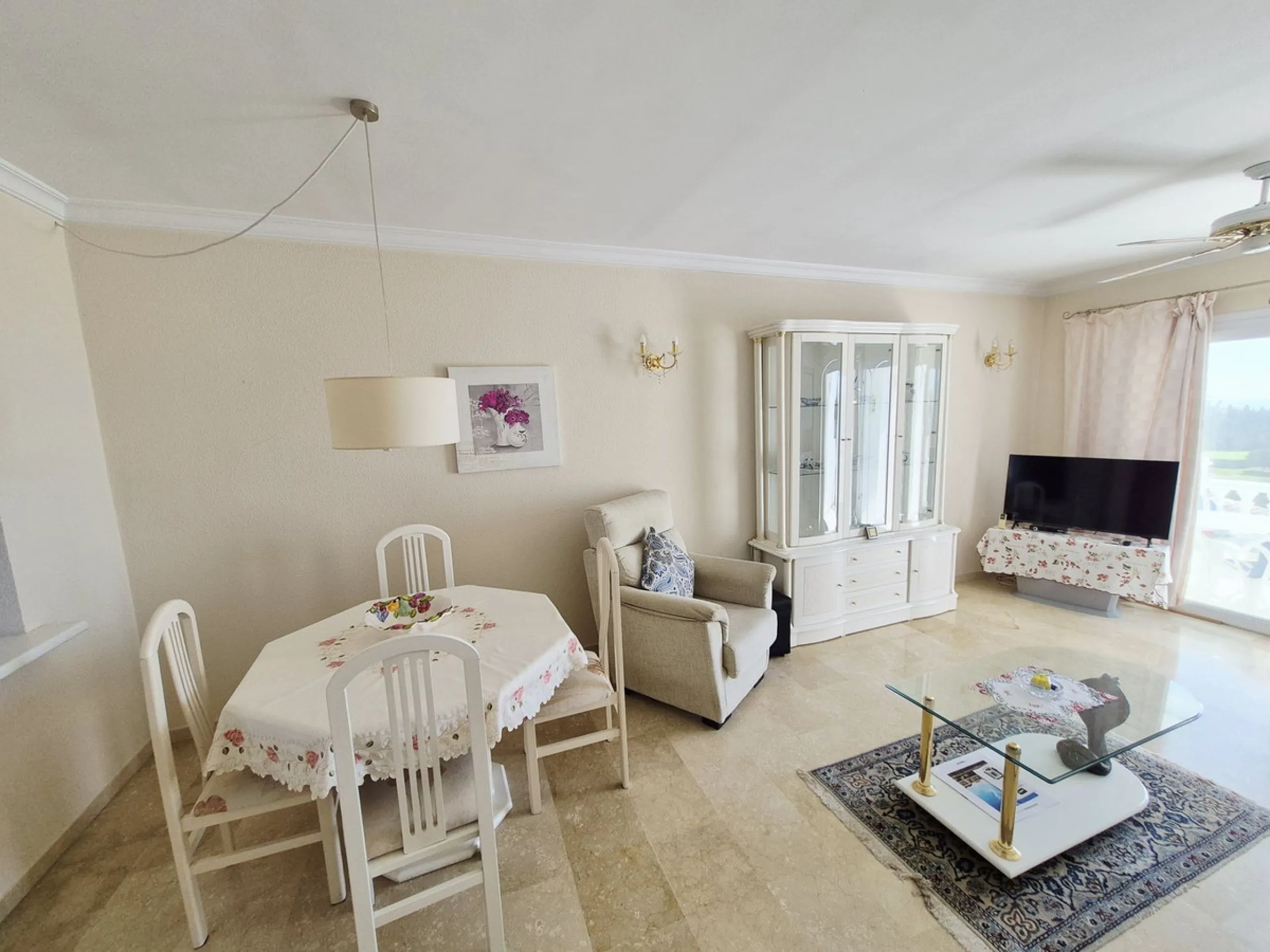 INCREDIBLE PANORAMIC VIEWS FROM THIS BRIGHT AND SPACIOUS APARTMENT WHICH LOOKS OUT OVER THE BAY OF LA CALA  AND EL CHAPARRAL GOLF COURSE.