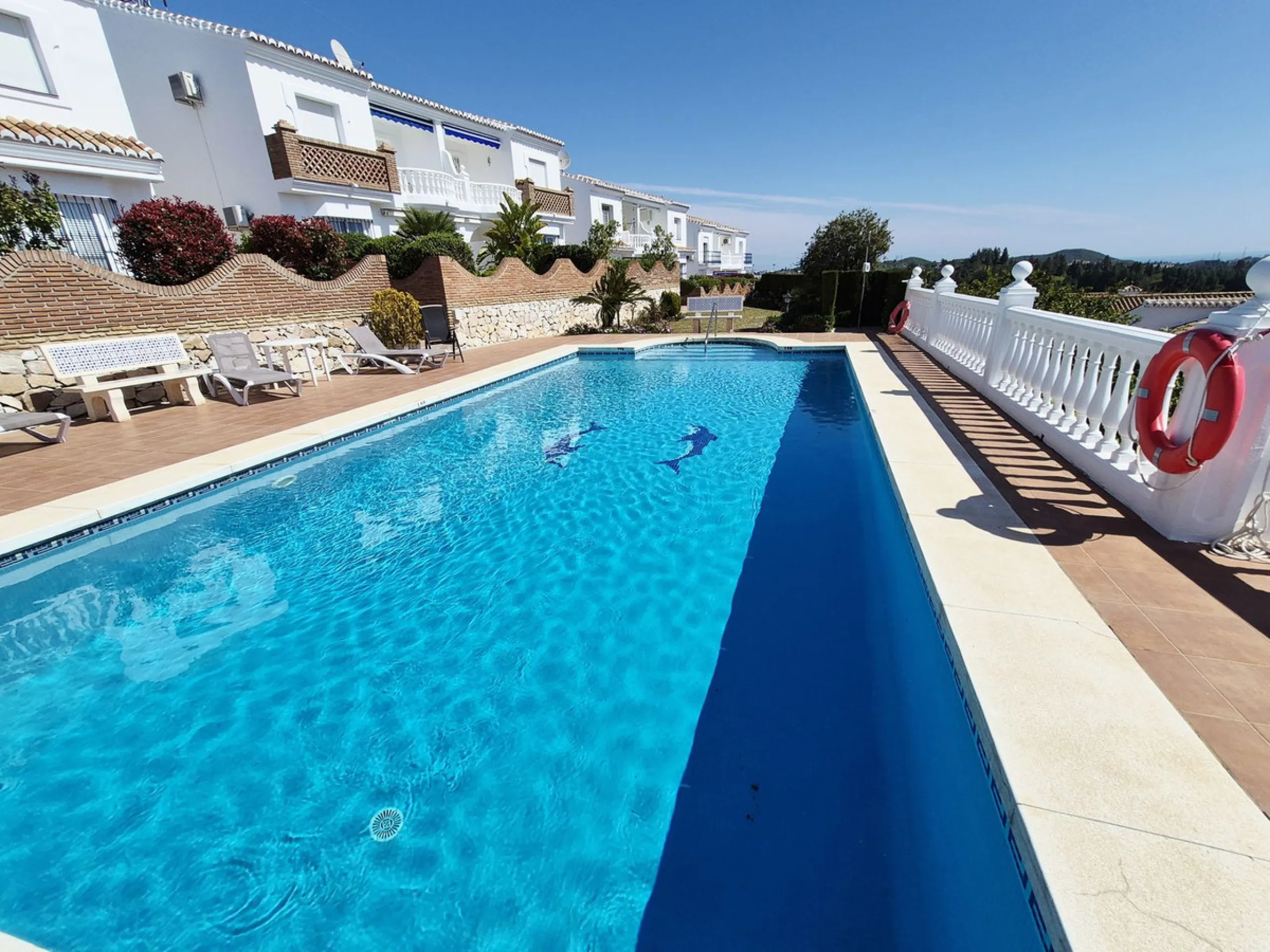 INCREDIBLE PANORAMIC VIEWS FROM THIS BRIGHT AND SPACIOUS APARTMENT WHICH LOOKS OUT OVER THE BAY OF LA CALA  AND EL CHAPARRAL GOLF COURSE.