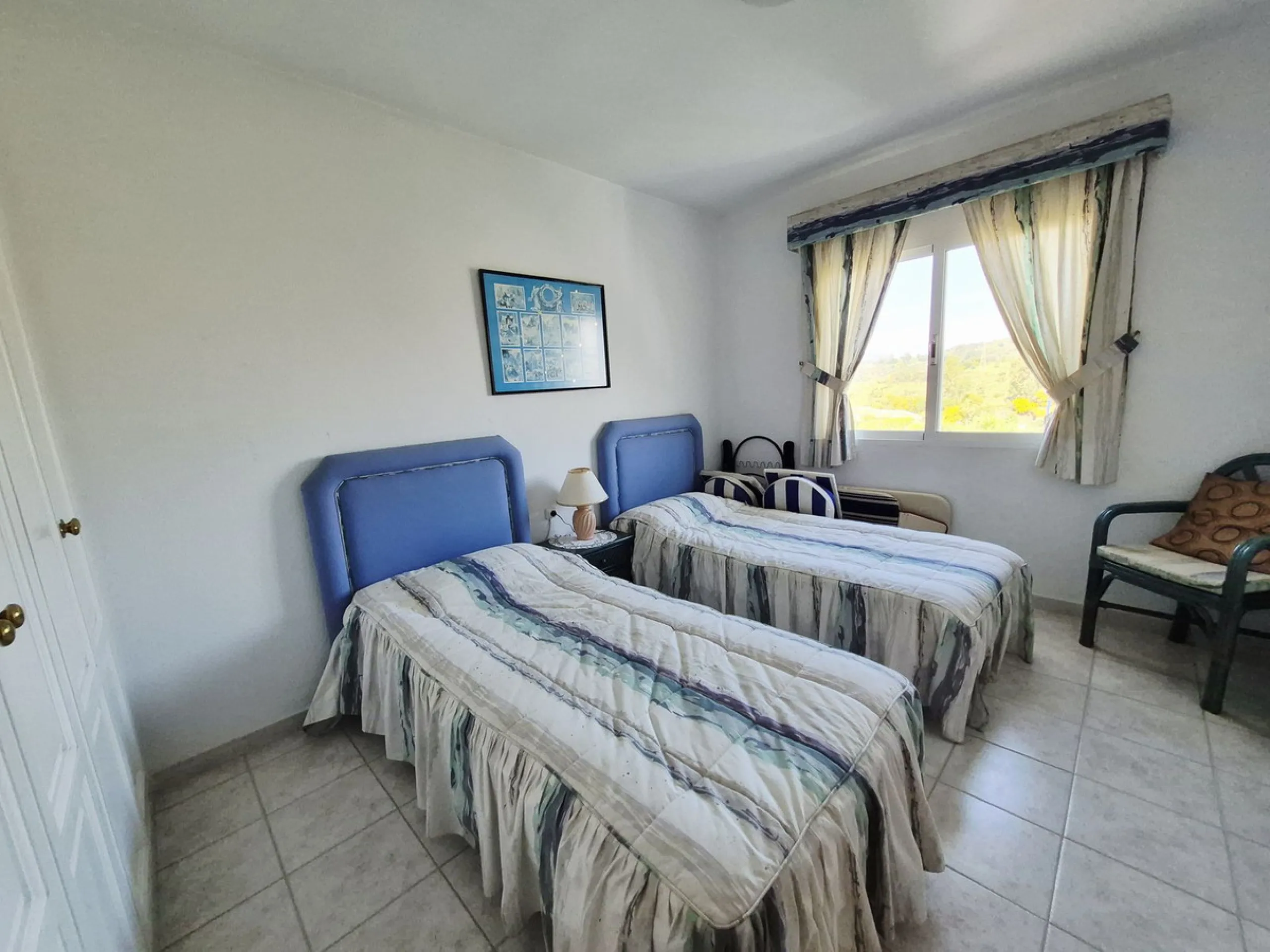 INCREDIBLE PANORAMIC VIEWS FROM THIS BRIGHT AND SPACIOUS APARTMENT WHICH LOOKS OUT OVER THE BAY OF LA CALA  AND EL CHAPARRAL GOLF COURSE.