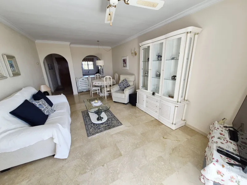 INCREDIBLE PANORAMIC VIEWS FROM THIS BRIGHT AND SPACIOUS APARTMENT WHICH LOOKS OUT OVER THE BAY OF LA CALA  AND EL CHAPARRAL GOLF COURSE.