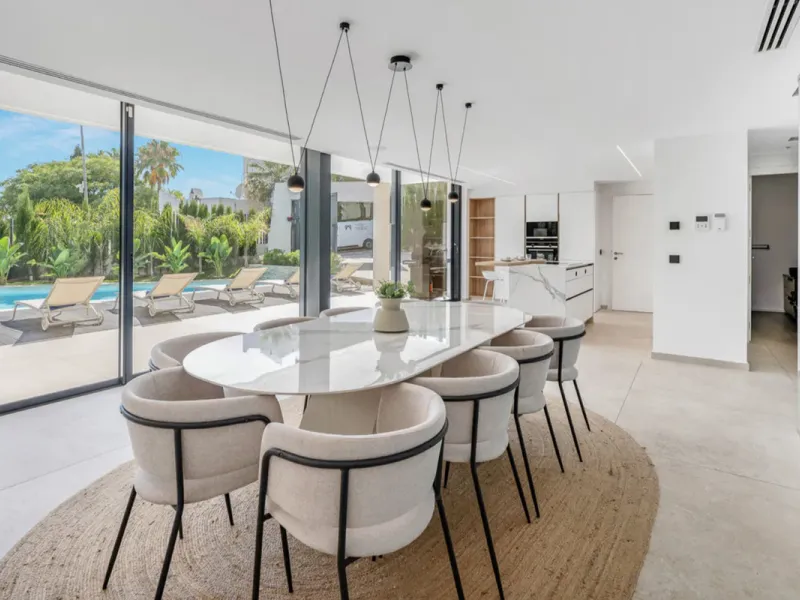 This stunning property is a modern luxury home in Reserva Marbella with open sea views and a bright open-plan design. The ground floor connects the kitchen, dining and living areas in one clean space that leads to a covered terrace, a landscaped garden an