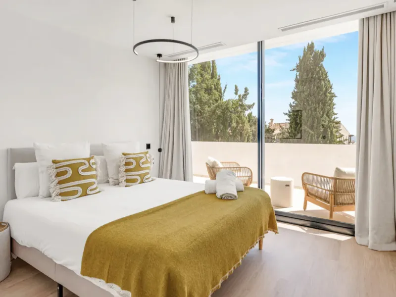This stunning property is a modern luxury home in Reserva Marbella with open sea views and a bright open-plan design. The ground floor connects the kitchen, dining and living areas in one clean space that leads to a covered terrace, a landscaped garden an