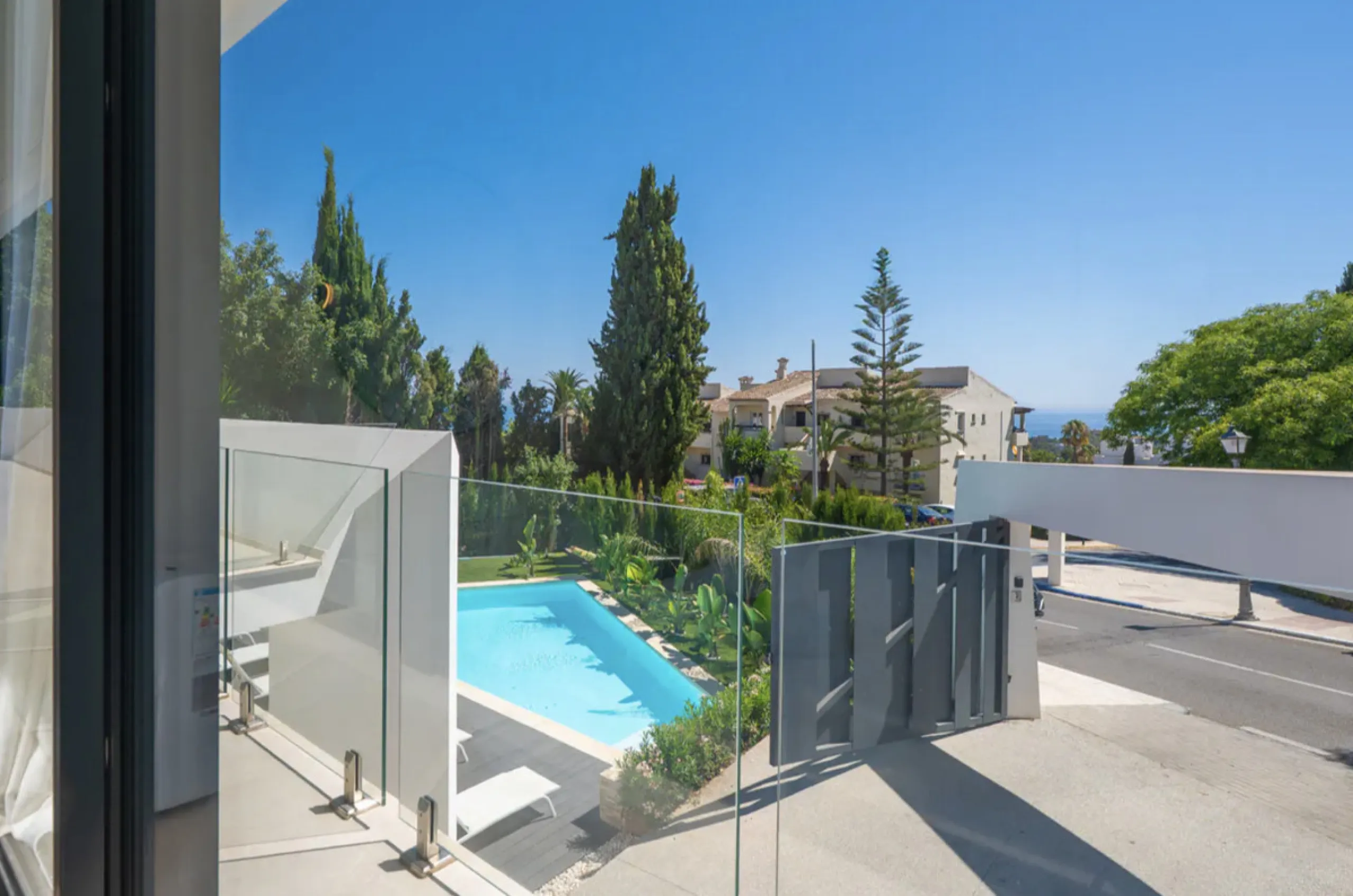 This stunning property is a modern luxury home in Reserva Marbella with open sea views and a bright open-plan design. The ground floor connects the kitchen, dining and living areas in one clean space that leads to a covered terrace, a landscaped garden an
