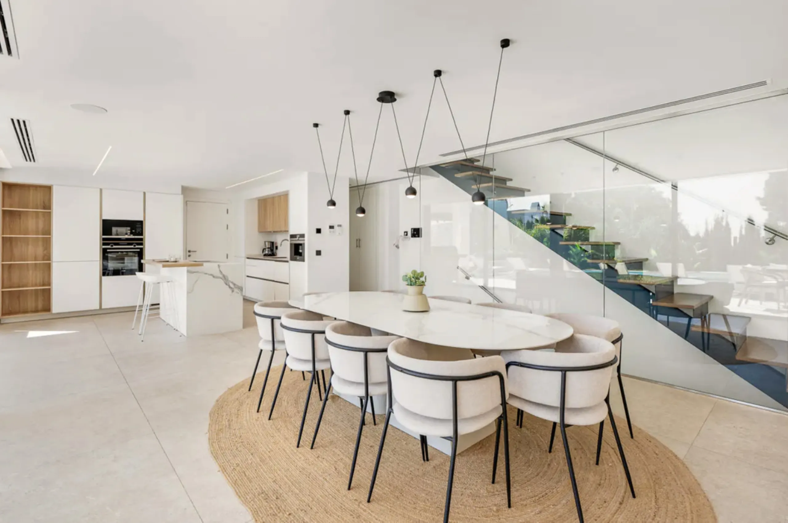This stunning property is a modern luxury home in Reserva Marbella with open sea views and a bright open-plan design. The ground floor connects the kitchen, dining and living areas in one clean space that leads to a covered terrace, a landscaped garden an