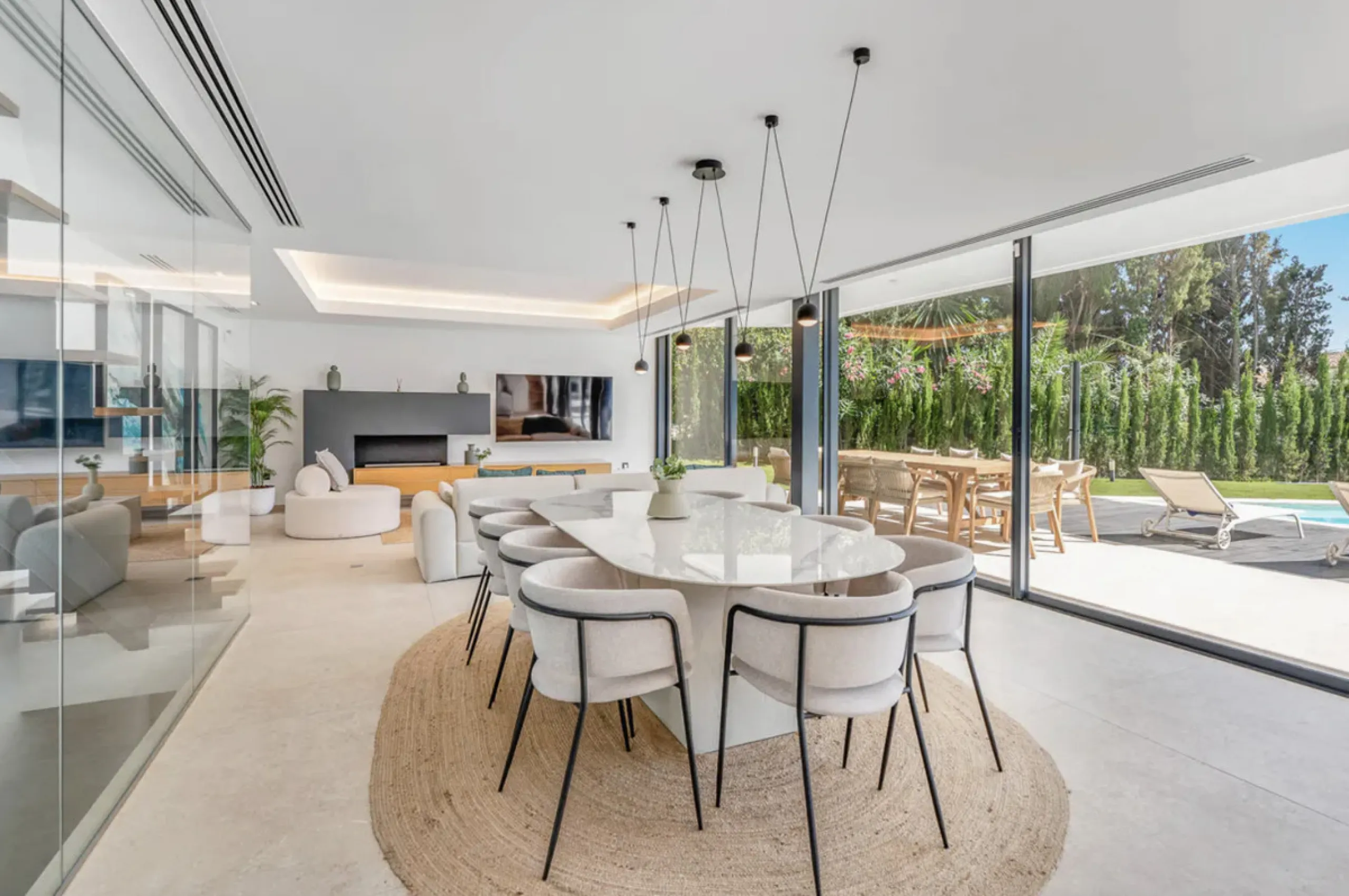 This stunning property is a modern luxury home in Reserva Marbella with open sea views and a bright open-plan design. The ground floor connects the kitchen, dining and living areas in one clean space that leads to a covered terrace, a landscaped garden an