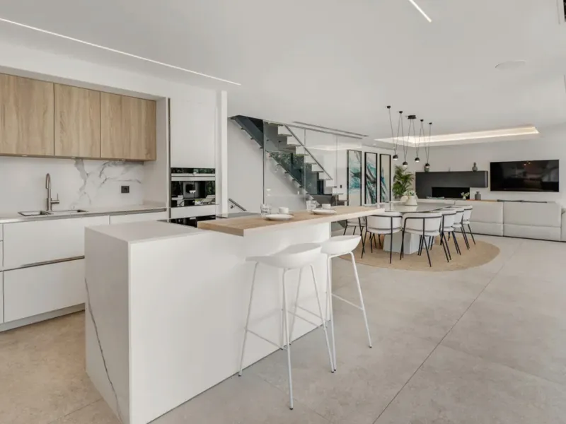 This stunning property is a modern luxury home in Reserva Marbella with open sea views and a bright open-plan design. The ground floor connects the kitchen, dining and living areas in one clean space that leads to a covered terrace, a landscaped garden an