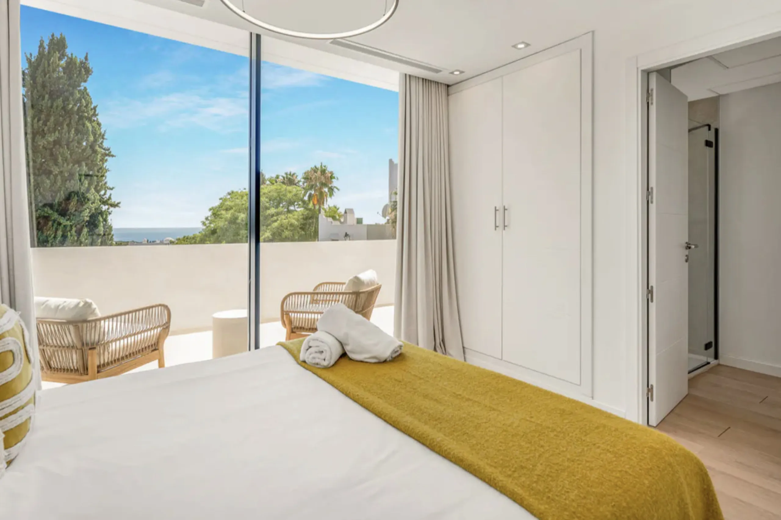 This stunning property is a modern luxury home in Reserva Marbella with open sea views and a bright open-plan design. The ground floor connects the kitchen, dining and living areas in one clean space that leads to a covered terrace, a landscaped garden an