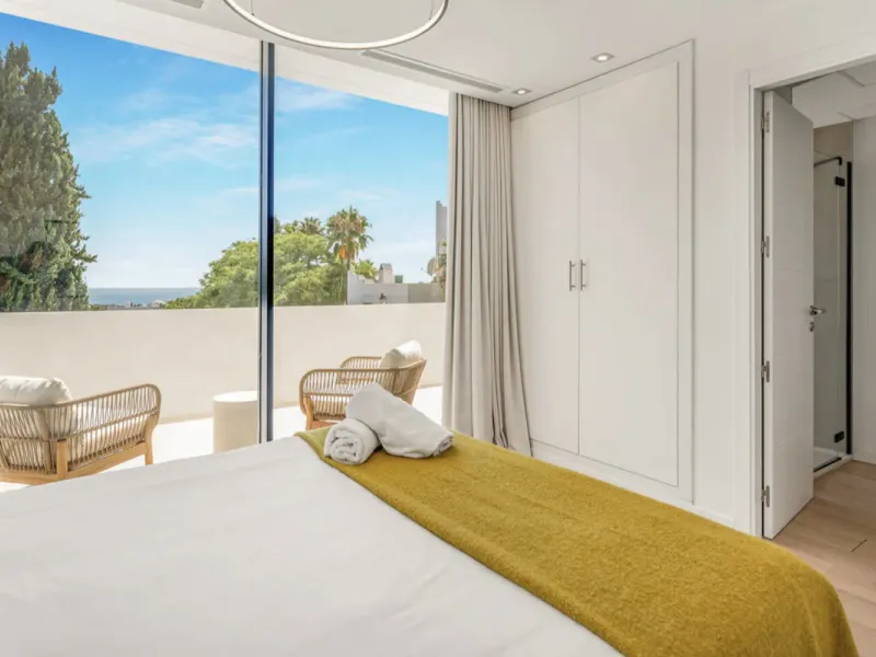 This stunning property is a modern luxury home in Reserva Marbella with open sea views and a bright open-plan design. The ground floor connects the kitchen, dining and living areas in one clean space that leads to a covered terrace, a landscaped garden an
