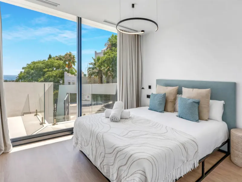 This stunning property is a modern luxury home in Reserva Marbella with open sea views and a bright open-plan design. The ground floor connects the kitchen, dining and living areas in one clean space that leads to a covered terrace, a landscaped garden an