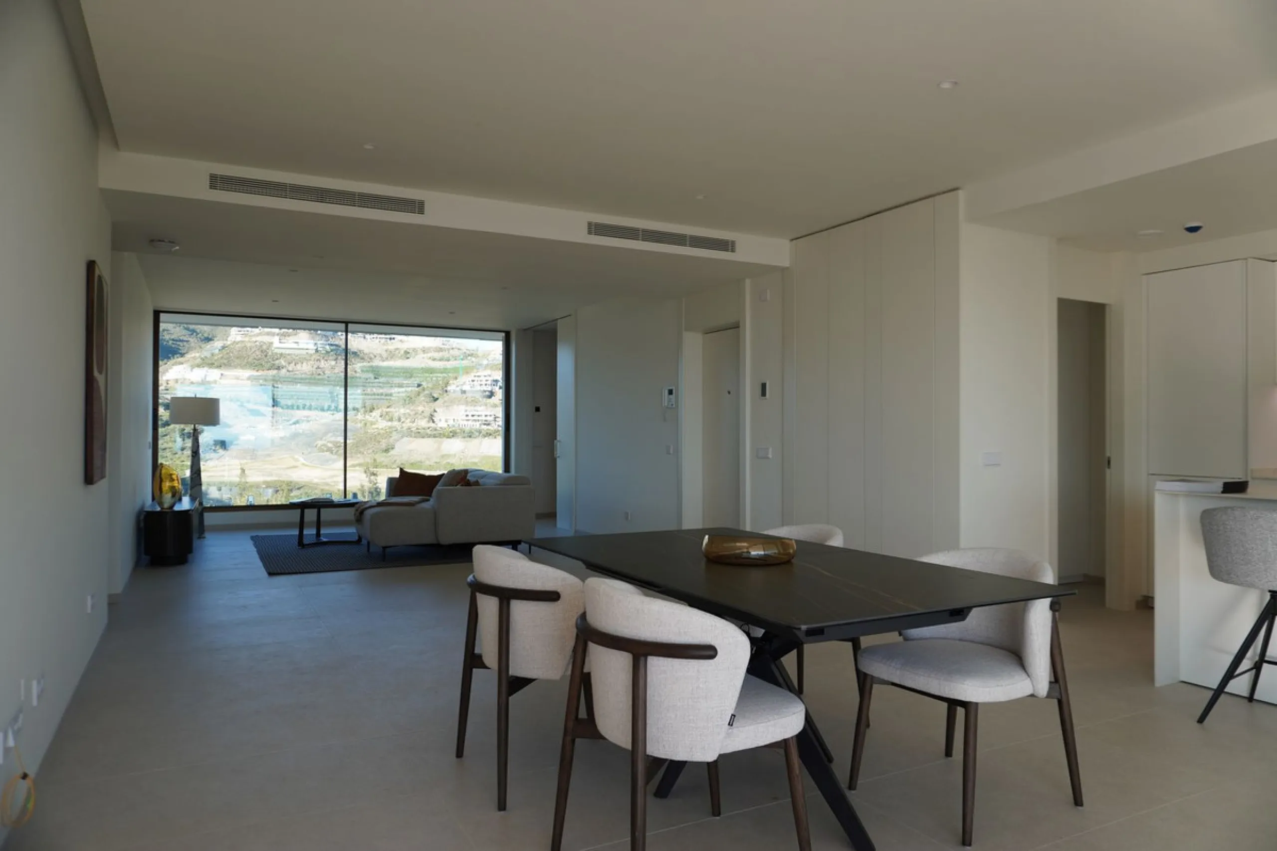 Discover a rare opportunity to own one of the very few 4-bedroom residences in the prestigious Palmitos development, La Quinta. This stunning apartment offers a spacious living room, fully equipped designer kitchen, four bedrooms, two bathrooms, and a gue