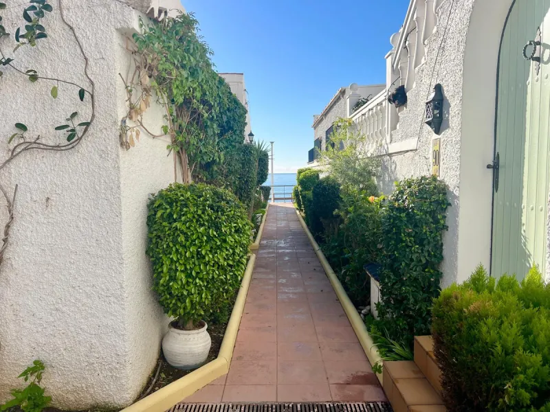 Beachfront complex in Estepona, New Golden Mile, between Cancelada and Selwo, close to Las Dunas. Stunning fully renovated corner semi-detached townhouse, located in a frontline beach complex with a unique charm, reminiscent of an authentic fishing villag