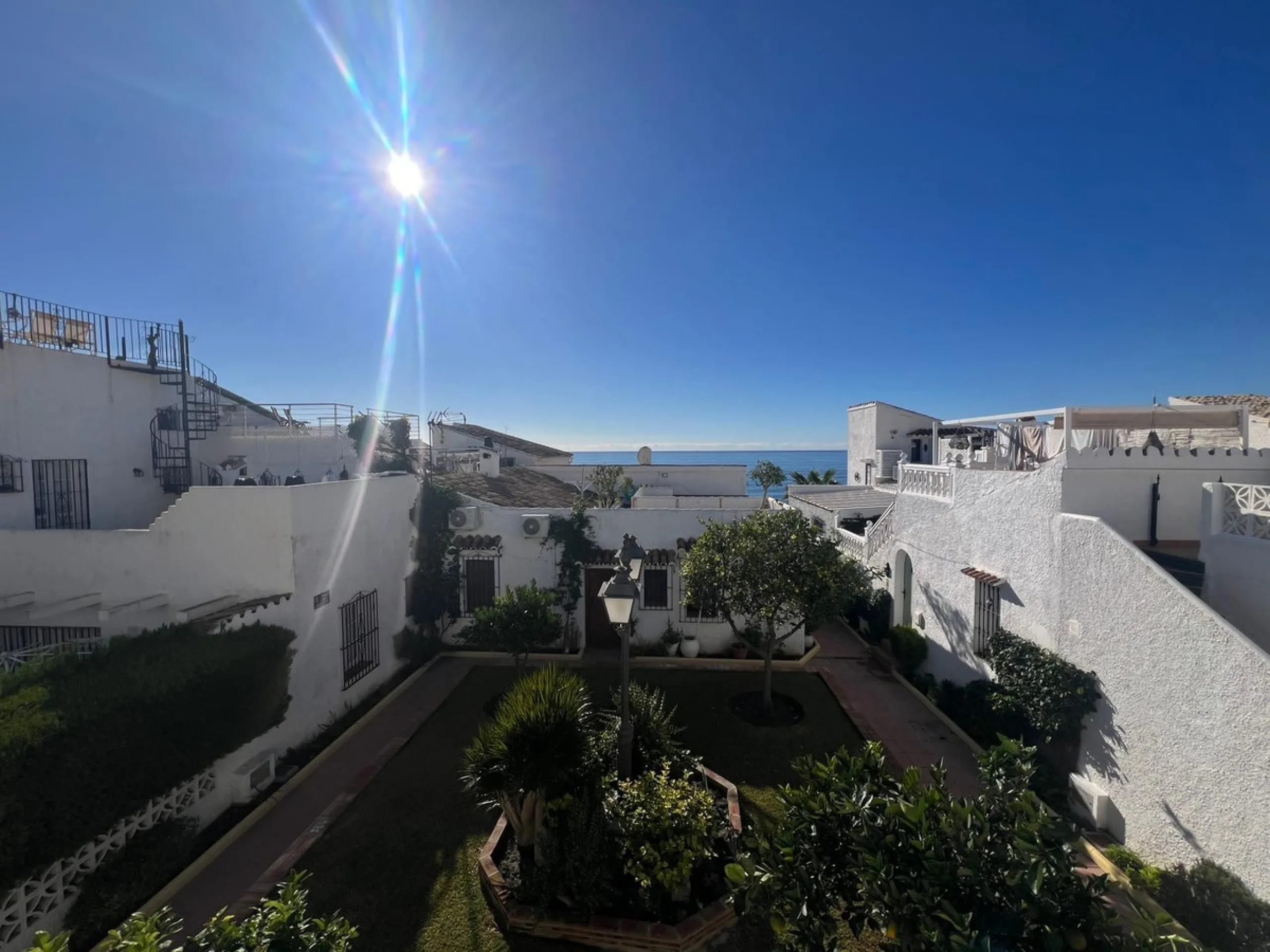 Beachfront complex in Estepona, New Golden Mile, between Cancelada and Selwo, close to Las Dunas. Stunning fully renovated corner semi-detached townhouse, located in a frontline beach complex with a unique charm, reminiscent of an authentic fishing villag