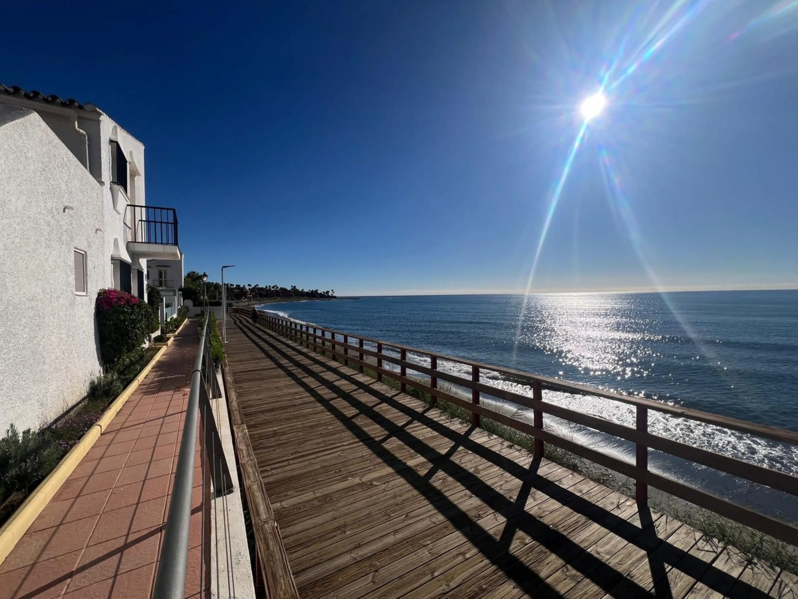 Beachfront complex in Estepona, New Golden Mile, between Cancelada and Selwo, close to Las Dunas. Stunning fully renovated corner semi-detached townhouse, located in a frontline beach complex with a unique charm, reminiscent of an authentic fishing villag