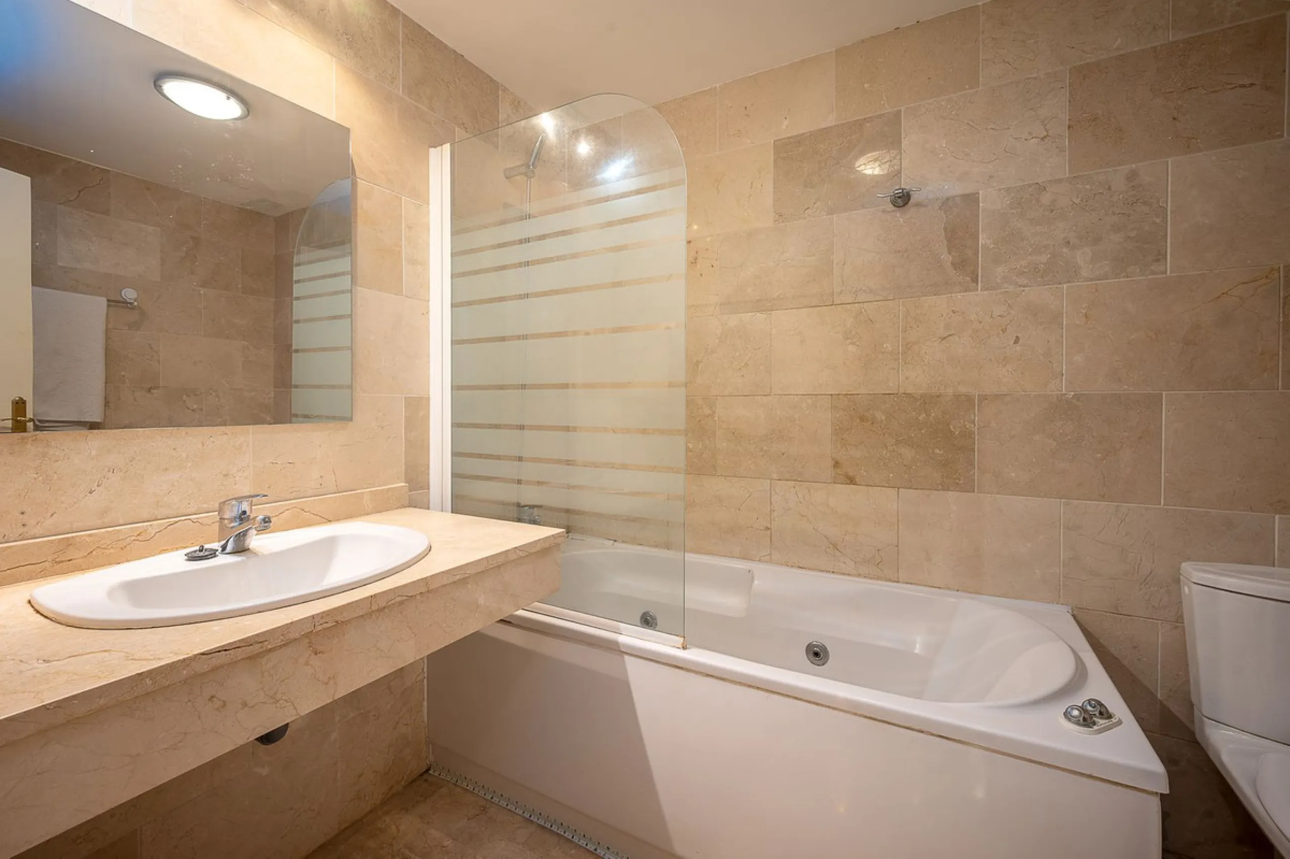 One-level apartment consisting of 3 double bedrooms, together with 3 bathrooms a large L shape terrace with the bonus of half being covered and the other half open to be able to enjoy the sun all day long which you has limited sea views. Property comes wi