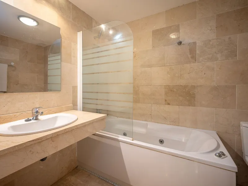 One-level apartment consisting of 3 double bedrooms, together with 3 bathrooms a large L shape terrace with the bonus of half being covered and the other half open to be able to enjoy the sun all day long which you has limited sea views. Property comes wi