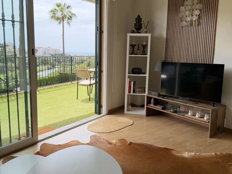 Perfect investment: TOURIST LICENCE and superbly located 2-bedroom apartment with panoramic sea and golf views