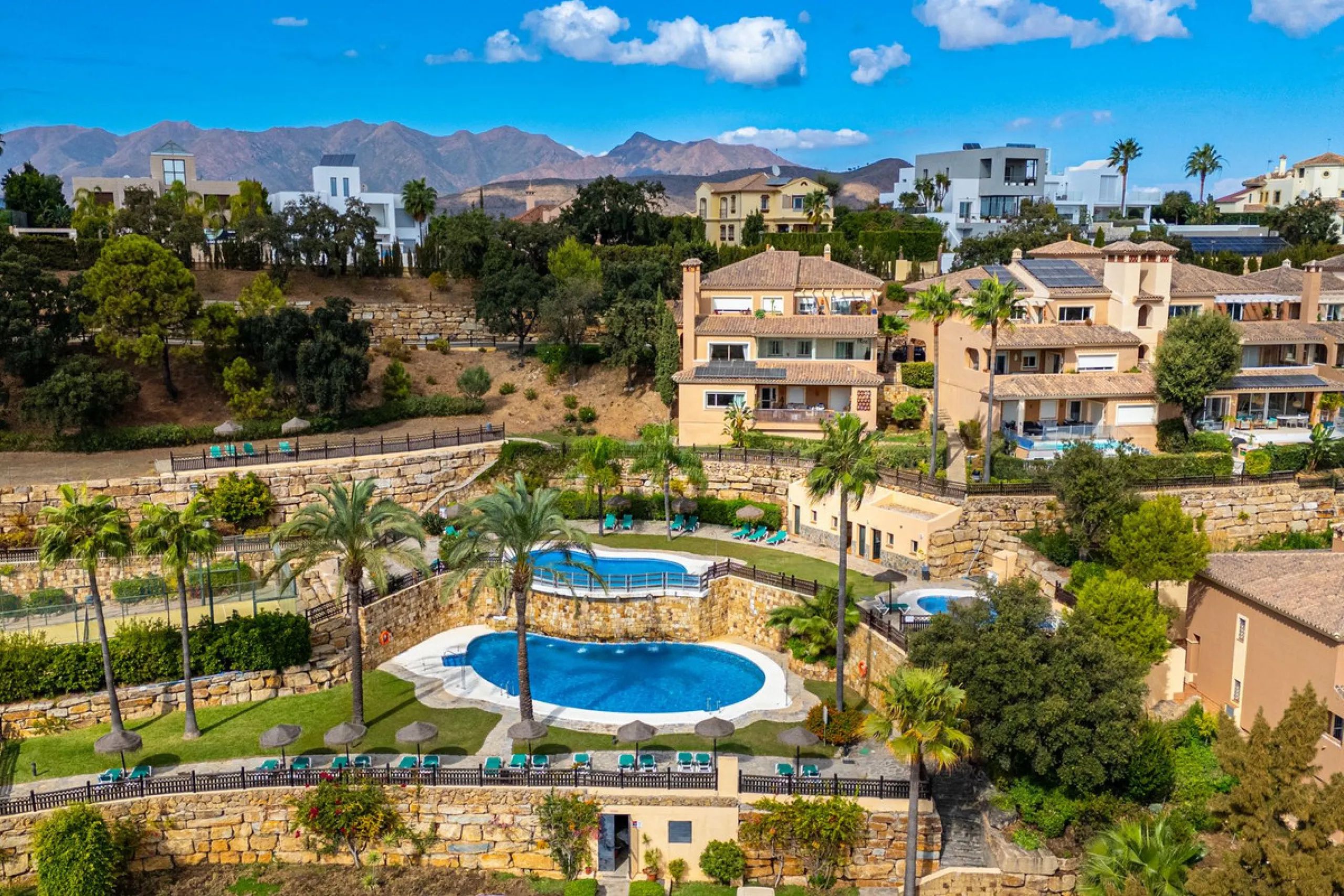 Discover this beautiful 2-bedroom 'penthouse-like feel' middle-floor apartment perfectly positioned in the prestigious enclave of La Mairena / Elviria Alta on Marbella's sought-after east coast. Surrounded by natural beauty, SEA and mountain views, this e
